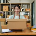 Startup small business entrepreneur SME, asian woman packing box. Portrait of young Asian small