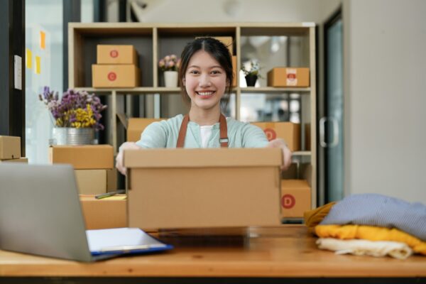 Startup small business entrepreneur SME, asian woman packing box. Portrait of young Asian small